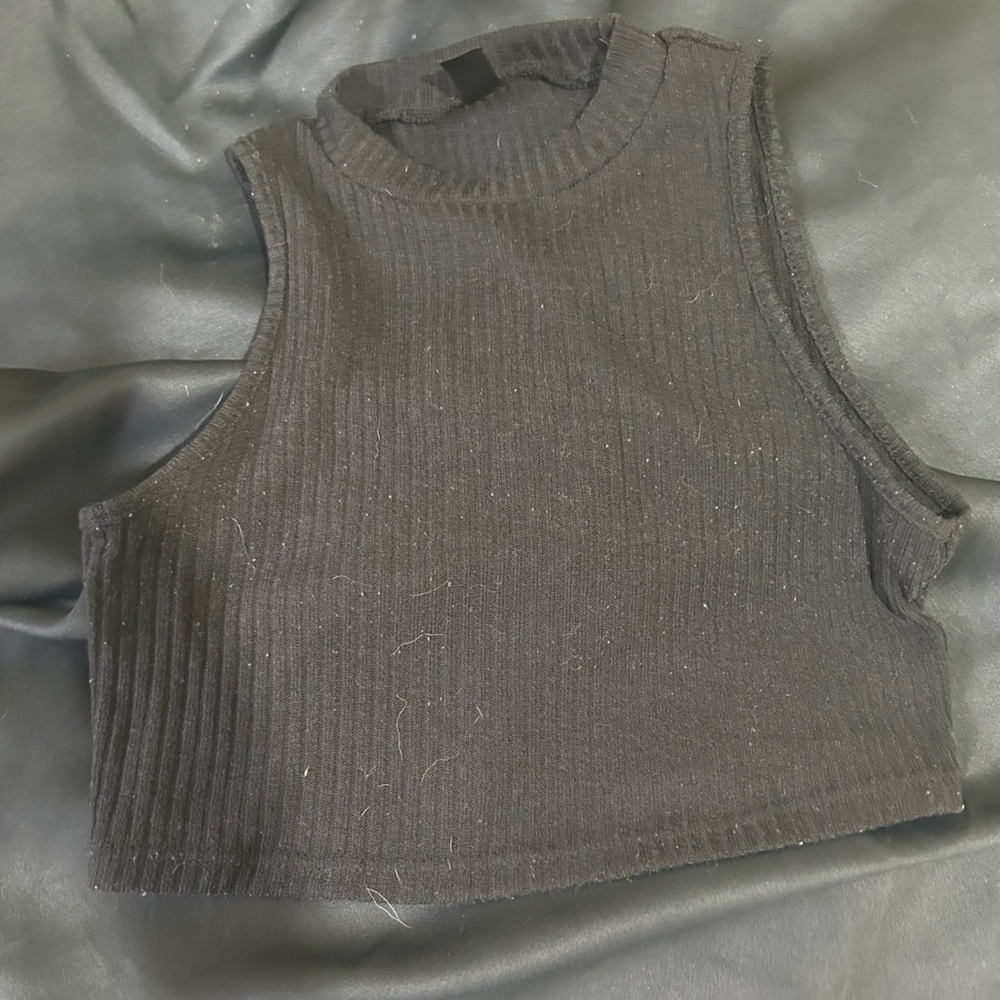 Small black shirt fits size MEDIUM
